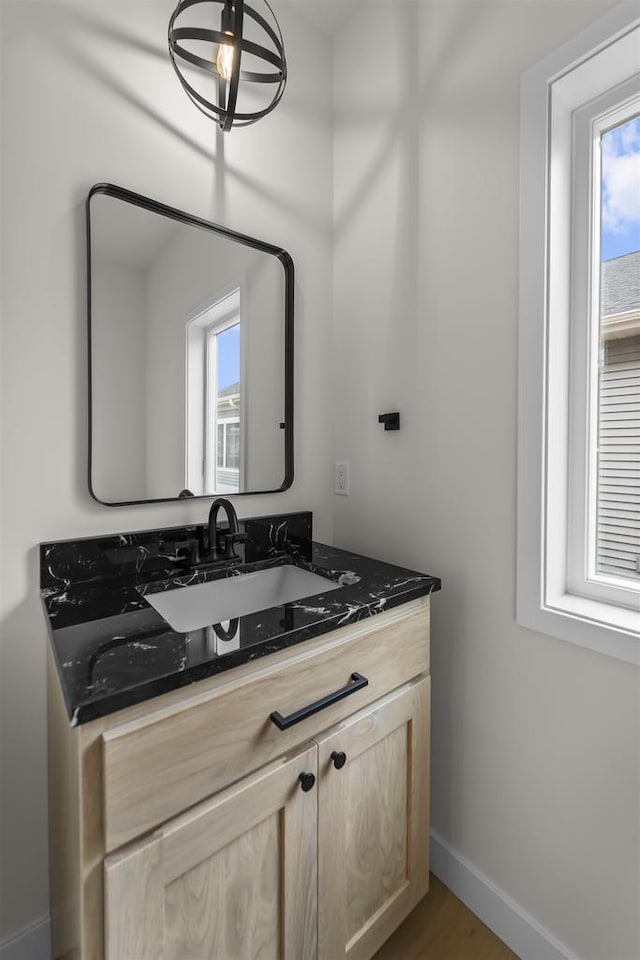 727 Schubert St, Verona, WI 53593 - bathroom featuring healthy amount of natural light, vanity, and baseboards