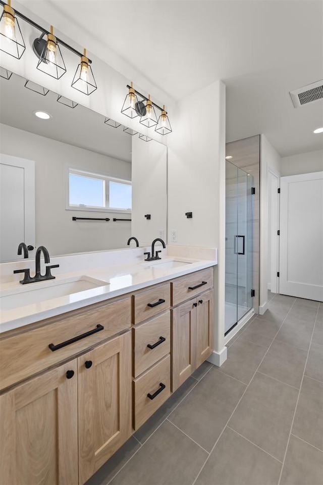 727 Schubert St, Verona, WI 53593 - full bathroom with double vanity, tile patterned flooring, and a stall shower