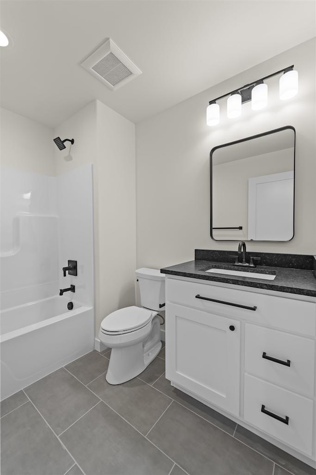 727 Schubert St, Verona, WI 53593 - bathroom with toilet, vanity, shower / bath combination, and tile patterned floors