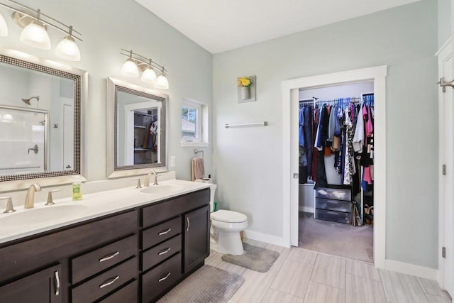 807 W Saddle Rdg Unit 807, Portage, WI 53901 - full bath with a shower stall, double vanity, a spacious closet, toilet, and baseboards