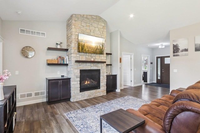 807 W Saddle Rdg Unit 807, Portage, WI 53901 - living room featuring high vaulted ceiling, dark wood finished floors, a fireplace, and baseboards