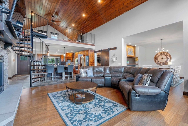 E12603 Bay Rd, Merrimac, WI 53561 - living area with stairs, high vaulted ceiling, a barn door, wood finished floors, and wood ceiling