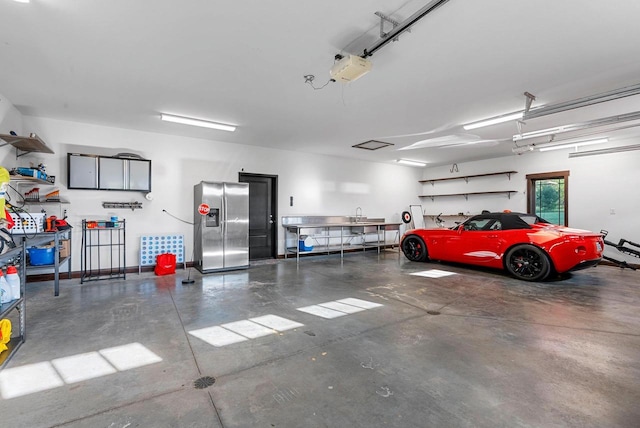 E12603 Bay Rd, Merrimac, WI 53561 - garage featuring stainless steel fridge with ice dispenser