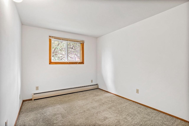 1923 Sherman Ave, Madison, WI 53704 - empty room with a baseboard heating unit, carpet floors, and baseboards