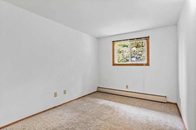 1923 Sherman Ave, Madison, WI 53704 - empty room featuring a baseboard radiator, carpet flooring, and baseboards