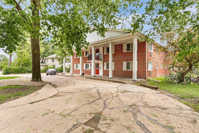 1923 Sherman Ave, Madison, WI 53704 - neoclassical home featuring brick siding and driveway
