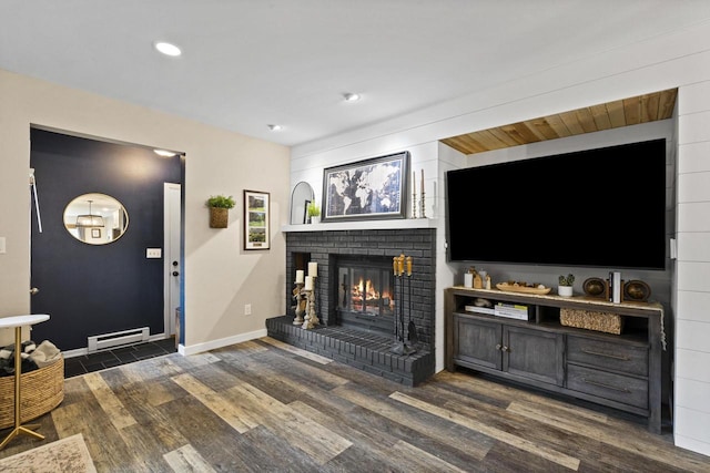 1115 Daniel Ct Unit 40, Neenah, WI 54956 - living room with wood finished floors, baseboard heating, a fireplace, baseboards, and recessed lighting