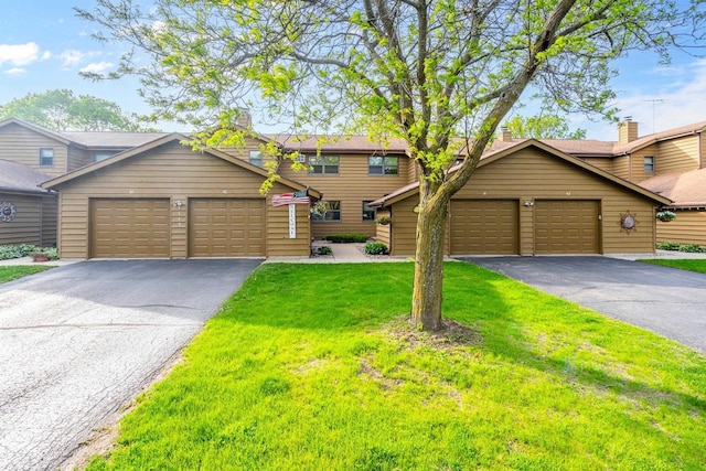 1115 Daniel Ct Unit 40, Neenah, WI 54956 - rustic home with driveway, a front yard, and a garage