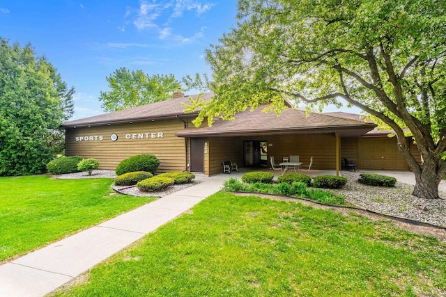 1115 Daniel Ct Unit 40, Neenah, WI 54956 - view of front of house with a front lawn and a patio