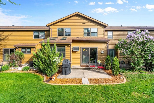 1115 Daniel Ct Unit 40, Neenah, WI 54956 - back of house featuring a patio and a yard