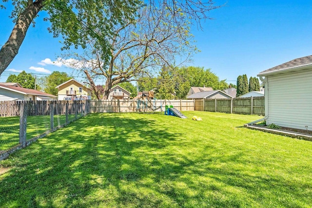 816 W Oklahoma St, Appleton, WI 54914 - view of yard with a playground and a residential view