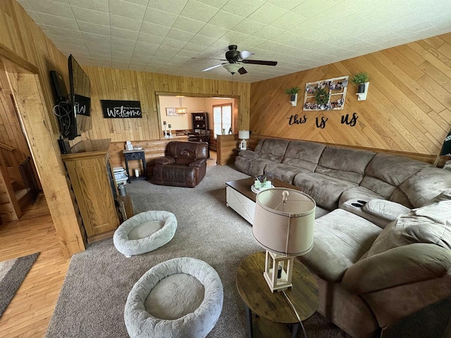 114 E Freeborn St, Cecil, WI 54111 - living area with wooden walls, a ceiling fan, and wood finished floors