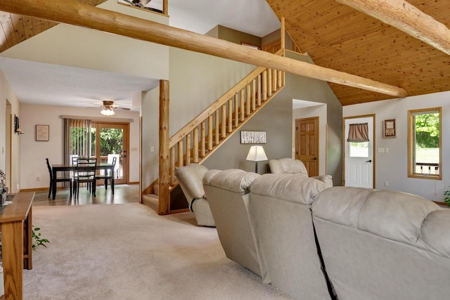 N17795 Trim Rd, Galesville, WI 54630 - carpeted living area with stairway, healthy amount of natural light, ceiling fan, and wood ceiling