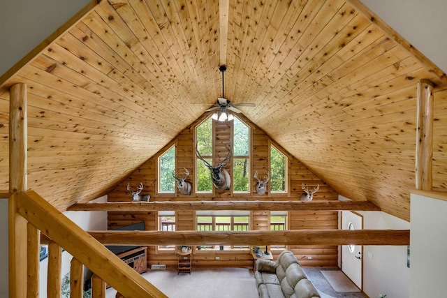 N17795 Trim Rd, Galesville, WI 54630 - unfurnished living room featuring wooden ceiling, a ceiling fan, rustic walls, and high vaulted ceiling