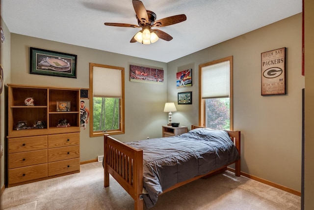 N17795 Trim Rd, Galesville, WI 54630 - carpeted bedroom featuring baseboards and ceiling fan