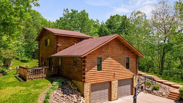 N17795 Trim Rd, Galesville, WI 54630 - view of side of property featuring log exterior, a deck, driveway, a garage, and roof with shingles