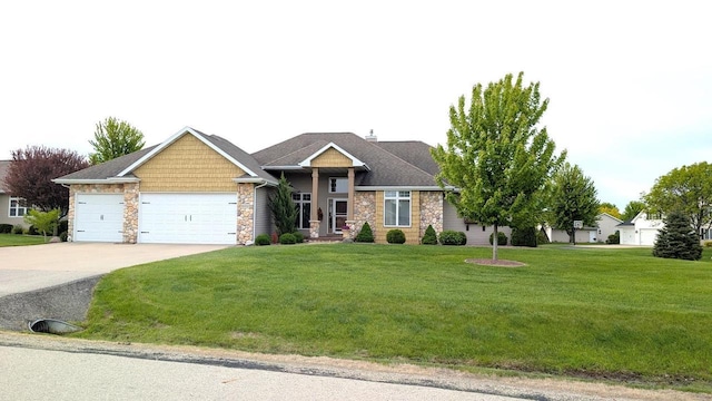 W4825 Wild Wings Dr, Sherwood, WI 54169 - craftsman-style home featuring a garage, driveway, stone siding, and a front lawn