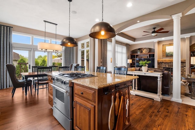 W4825 Wild Wings Dr, Sherwood, WI 54169 - kitchen with high end range, ornate columns, dark wood finished floors, a kitchen island, and ceiling fan