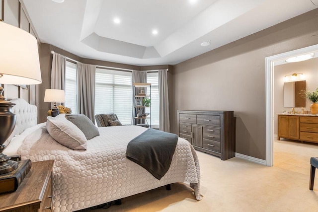 W4825 Wild Wings Dr, Sherwood, WI 54169 - bedroom with a tray ceiling, light colored carpet, ensuite bathroom, recessed lighting, and baseboards