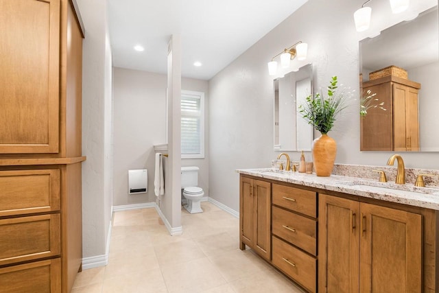 W4825 Wild Wings Dr, Sherwood, WI 54169 - full bath with double vanity, tile patterned flooring, toilet, baseboards, and heating unit