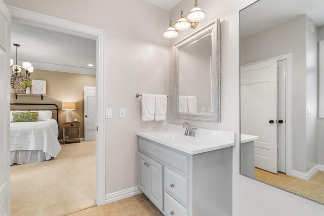 W4825 Wild Wings Dr, Sherwood, WI 54169 - bathroom with vanity, a chandelier, ensuite bathroom, baseboards, and recessed lighting