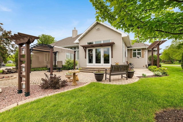 W4825 Wild Wings Dr, Sherwood, WI 54169 - back of house featuring a pergola, a patio area, a yard, and french doors