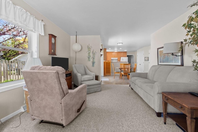 1242 Liberty St, Oshkosh, WI 54901 - living area featuring light carpet and baseboards