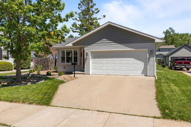 1242 Liberty St, Oshkosh, WI 54901 - ranch-style house featuring driveway and a garage