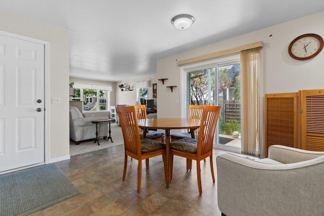 1242 Liberty St, Oshkosh, WI 54901 - dining area with baseboards