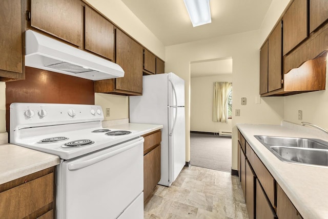 521 E Grand Ave, Rosholt, WI 54473 - kitchen featuring white appliances, under cabinet range hood, a sink, and light countertops