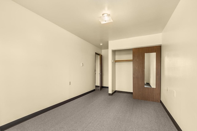 521 E Grand Ave, Rosholt, WI 54473 - unfurnished bedroom with baseboards, a closet, and carpet flooring