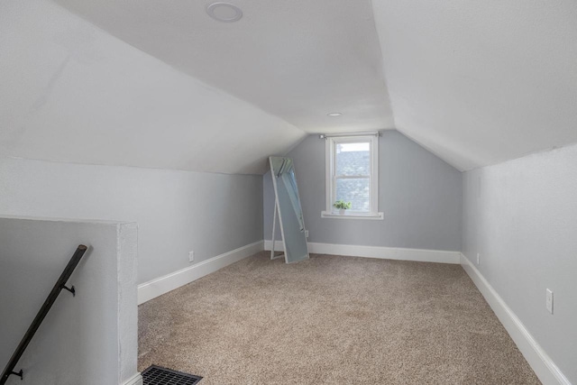 2801 Harvey St, La Crosse, WI 54603 - additional living space featuring lofted ceiling, carpet flooring, and baseboards