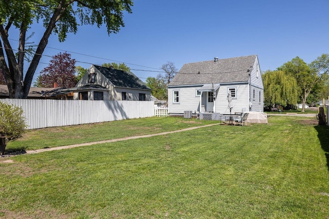 2801 Harvey St, La Crosse, WI 54603 - rear view of property featuring roof with shingles and central AC unit
