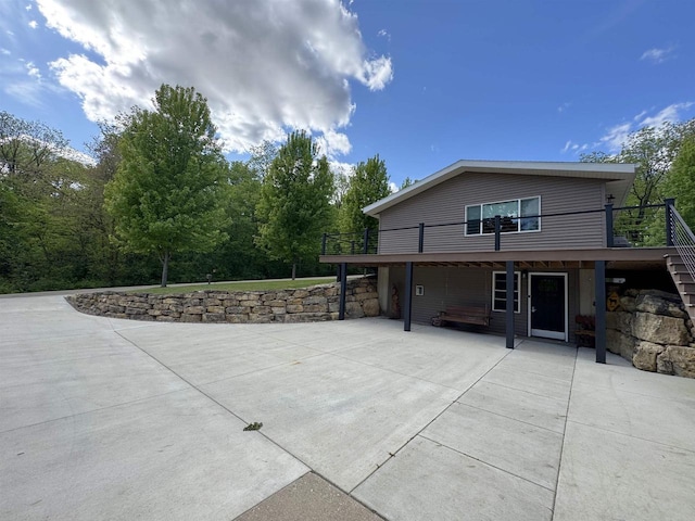 N3140 Forest Prairie Park Rd, Monroe, WI 53566 - rear view of house with a patio and a deck