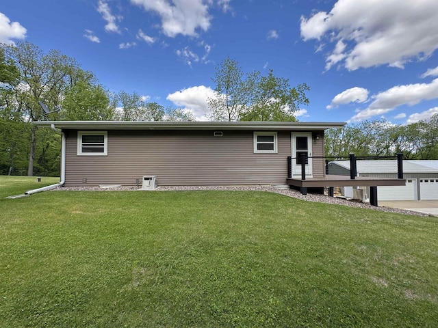 N3140 Forest Prairie Park Rd, Monroe, WI 53566 - rear view of property with a lawn and a garage