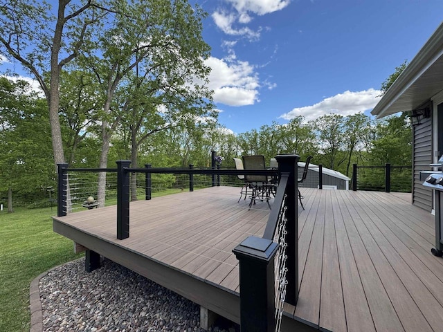 N3140 Forest Prairie Park Rd, Monroe, WI 53566 - wooden terrace with outdoor dining space, view of scattered trees, and a yard