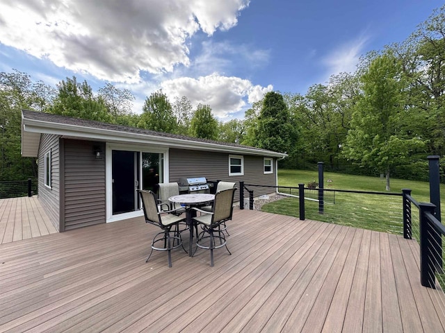 N3140 Forest Prairie Park Rd, Monroe, WI 53566 - wooden terrace featuring a lawn, outdoor dining space, and area for grilling