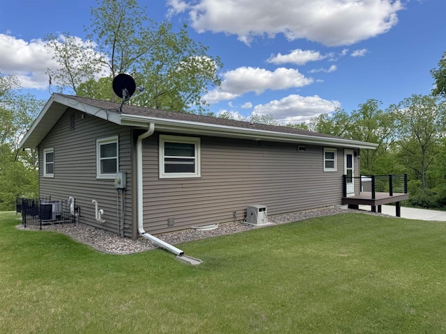 N3140 Forest Prairie Park Rd, Monroe, WI 53566 - view of side of home featuring a lawn and central AC unit
