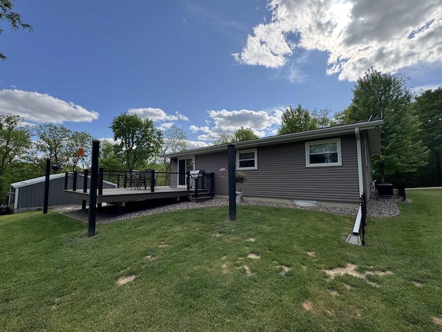 N3140 Forest Prairie Park Rd, Monroe, WI 53566 - rear view of property featuring a deck, a yard, and central AC