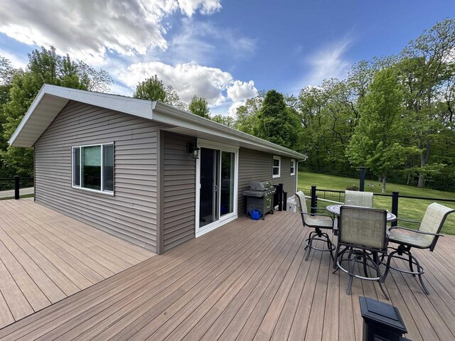 N3140 Forest Prairie Park Rd, Monroe, WI 53566 - wooden terrace featuring area for grilling, outdoor dining area, and a yard