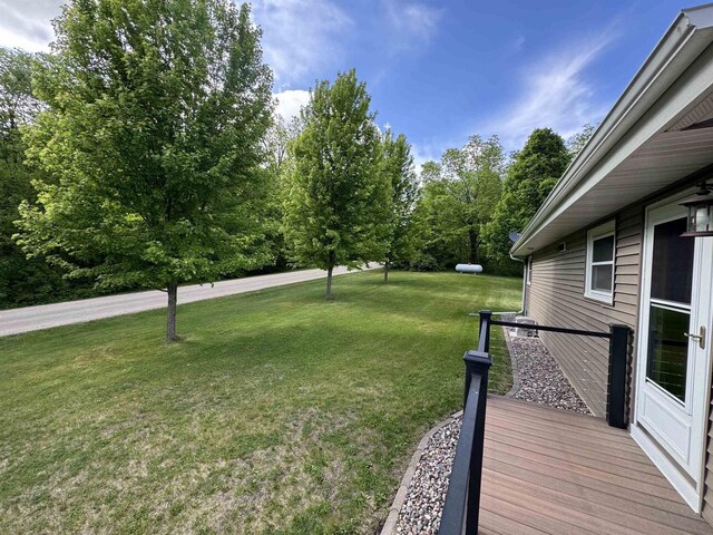 N3140 Forest Prairie Park Rd, Monroe, WI 53566 - view of green lawn with a wooden deck