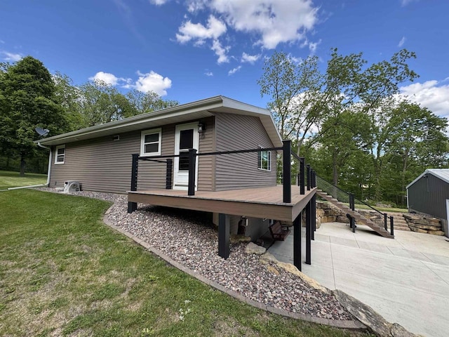 N3140 Forest Prairie Park Rd, Monroe, WI 53566 - view of property exterior with a deck, a lawn, a patio area, and stairs