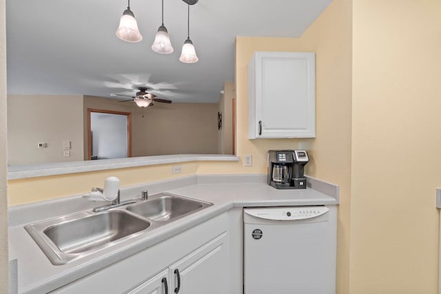 10 Kings Mill Cir Unit 113, Madison, WI 53718 - kitchen with white dishwasher, a sink, white cabinets, ceiling fan, and decorative light fixtures