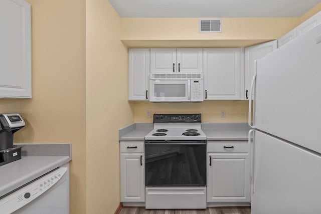 10 Kings Mill Cir Unit 113, Madison, WI 53718 - kitchen featuring white appliances, white cabinetry, and light countertops