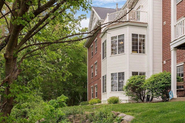 10 Kings Mill Cir Unit 113, Madison, WI 53718 - view of side of property featuring a balcony
