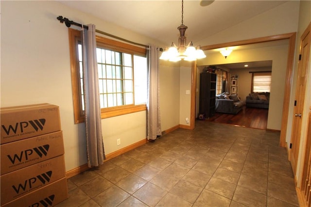 1808 Curtiss St, Eau Claire, WI 54703 - unfurnished dining area featuring a chandelier, baseboards, and lofted ceiling