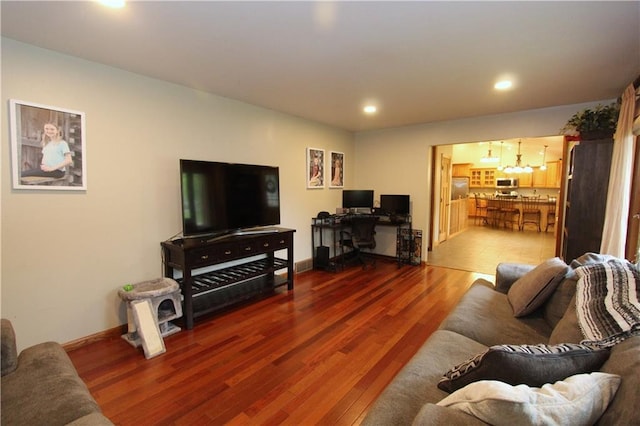 1808 Curtiss St, Eau Claire, WI 54703 - living room with a chandelier, wood finished floors, recessed lighting, an office area, and baseboards