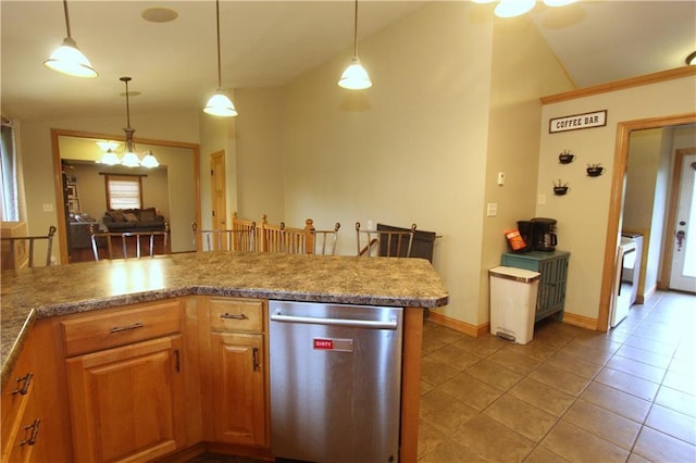 1808 Curtiss St, Eau Claire, WI 54703 - kitchen with lofted ceiling, stainless steel dishwasher, pendant lighting, light tile patterned floors, and baseboards