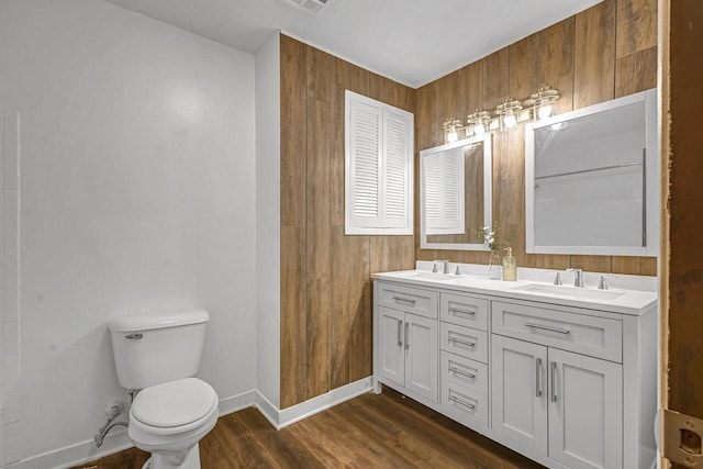 6112 W Port Ave, Milwaukee, WI 53223 - bathroom with double vanity, wood finished floors, toilet, and baseboards