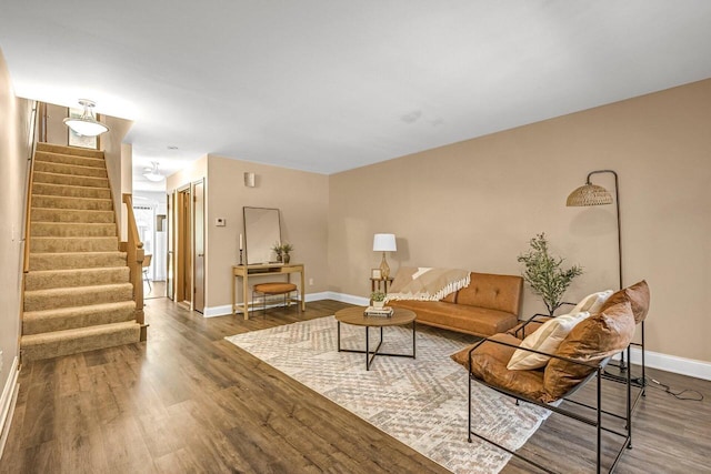 6112 W Port Ave, Milwaukee, WI 53223 - living room with baseboards, stairs, and wood finished floors